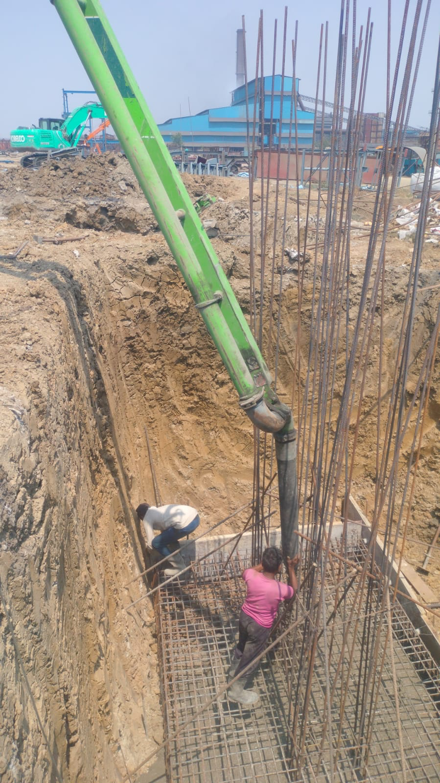 Concrete pump pouring on site
